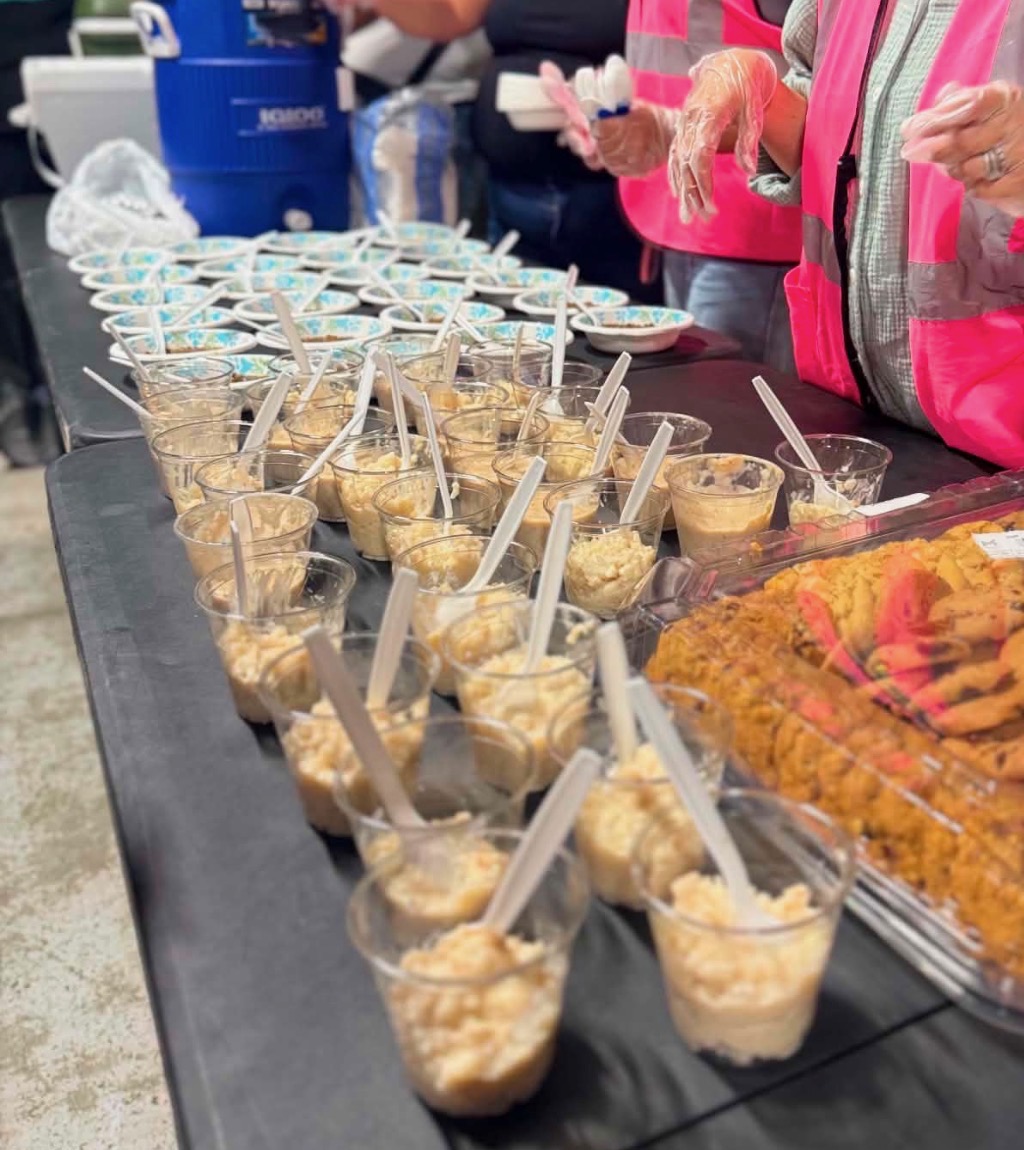 Rows of dessert cups and cookies prepared for the community