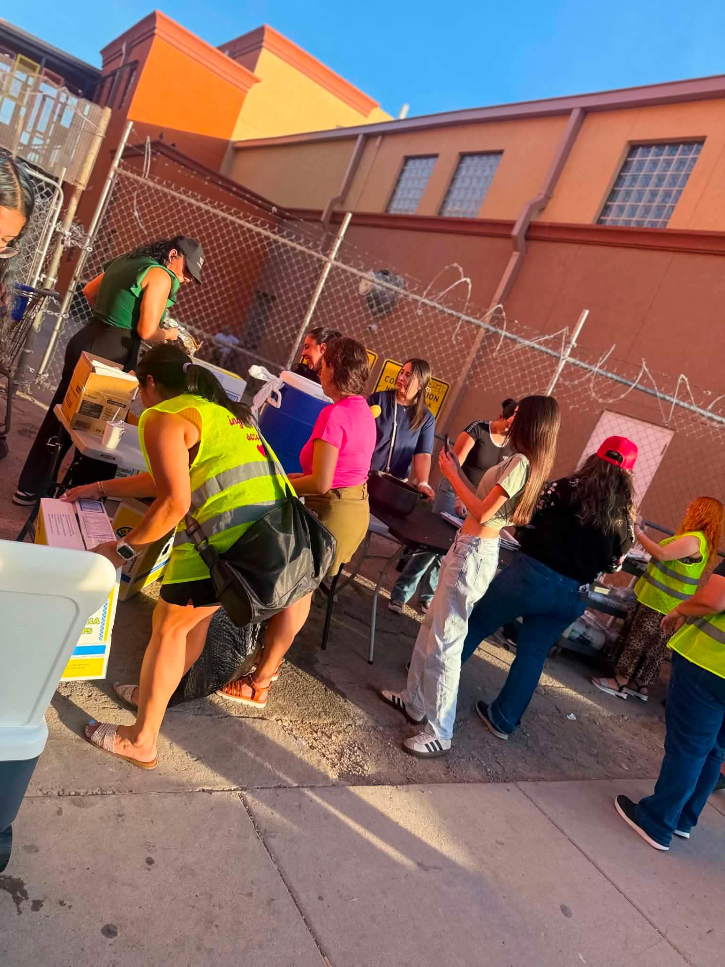 Volunteers unloading supplies and setting up for the evening
